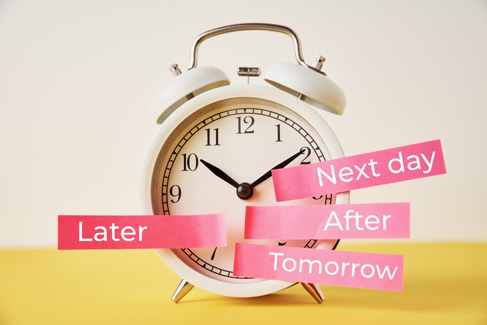 Delay and Postpone Concept. Alarm Clock with Sticky Notes 